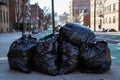 Black Garbage Bags Filled with Trash along the Street in Astoria Queens New York Royalty Free Stock Photo