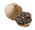 Black garlic bulbs isolated on white background