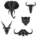 The black geometric heads of elephant, blue wildebeest, cheetah, eland antelope and cape buffalo. Set polygonal abstract
