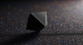 Black geometric solid rests on sparkling glitter Royalty Free Stock Photo