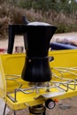 Black geyser coffee maker on a portable gas camping stove Royalty Free Stock Photo