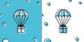 Black Gift box flying on parachute icon isolated on blue and white background. Delivery service, air shipping concept Royalty Free Stock Photo