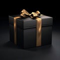 Black gift, box with gold bow, black background. Gifts as a day symbol of present and