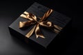 Black Gift Box with Golden Bow Overhead View Royalty Free Stock Photo