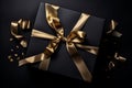 Black Gift Box with Golden Bow Overhead View Royalty Free Stock Photo