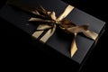 Black Gift Box with Golden Bow Overhead View Royalty Free Stock Photo