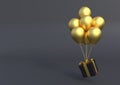 Black gift box with golden ribbon and balloon on pastel black background Royalty Free Stock Photo