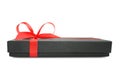 Black gift box (present) with red satin ribbon bow Royalty Free Stock Photo