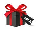 Black gift box with red bow and sale tag Royalty Free Stock Photo