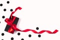 Black gift box with red ribbon on white Royalty Free Stock Photo