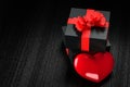 black gift box and red heart as symbol of eternal love Royalty Free Stock Photo