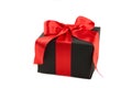 Black gift box with red ribbon and bow isolated on white background Royalty Free Stock Photo