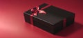 black gift box with red ribbon isolated on red background thanksgiving day