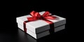 White gift box with red satin ribbon bow isolated on black Royalty Free Stock Photo