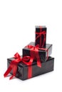 Black gift box with red satin ribbon and bow Royalty Free Stock Photo