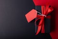 Black gift box and red tag with red ribbon on black background and red background for 11.11 Single day, Moday, Black Friday,