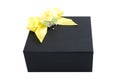 Black gift box with yellow bow Royalty Free Stock Photo