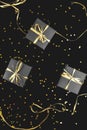 Black gift boxes with gold ribbon on shine background.