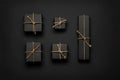 Black gift boxes tied with golden rope on black Royalty Free Stock Photo