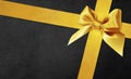 Black gift card with golden ribbon bow. black friday concept