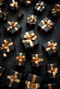 Black gift group with golden ribbons on black background.