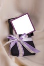 Black gift with a purple bow