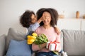 Black girl celebrating mother& x27;s day, greeting her mom Royalty Free Stock Photo