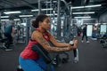 Black girl doing lifting weight for biceps in gym Royalty Free Stock Photo