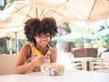 Black girl eating a healthy salad outdoors Royalty Free Stock Photo