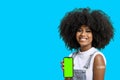 Black girl without face shield holds the cell phone close to her arm with the vaccine sticker, fully immunized, chroma key on the