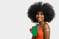 Black girl without face shield holds the cell phone close to her arm with the vaccine sticker, fully immunized, chroma key on the