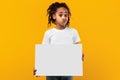 Black girl holding blank white advertising billboard at studio Royalty Free Stock Photo