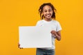 Black girl holding blank white advertising billboard at studio Royalty Free Stock Photo