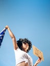 Black girl holding a US flag and a black lives matter sign