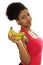 Black girl holds bananas in hand