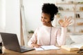 Black Girl At Laptop Waving Hello Sitting At Home Royalty Free Stock Photo