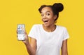 Black Girl Showing Smartphone With Physical Activity Application, Yellow Background