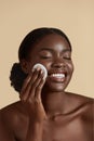 Black girl touch her face with cotton pad Royalty Free Stock Photo