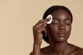 Black girl touch her face with cotton pad Royalty Free Stock Photo