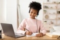 Black Girl Using Laptop Computer Doing Homework Online Sitting Indoor Royalty Free Stock Photo