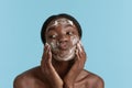 Black girl wash face with cleansing face foam Royalty Free Stock Photo