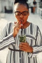 Beautiful black girl standing in a summer park