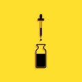 Black Glass bottle with a pipette. Vial with a pipette inside and lid icon isolated on yellow background. Container for Royalty Free Stock Photo