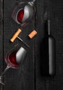 Black glass bottle with wine with corks on black wood background Poster concept design photo shooting Royalty Free Stock Photo