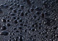 Black glass with natural water drops