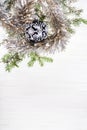 Black glass Xmas bauble and twig on blank paper