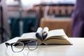 Black glasses on the background of the book Royalty Free Stock Photo