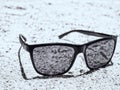 Black glasses on the sand on the beach of Hurghada