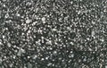 Black glitter sparkle background. Black friday shiny pattern with sequins. Christmas glamour luxury black christmas and glitter Royalty Free Stock Photo