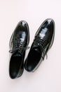 Black glossy men`s classic derby shoes on a white background. Royalty Free Stock Photo
